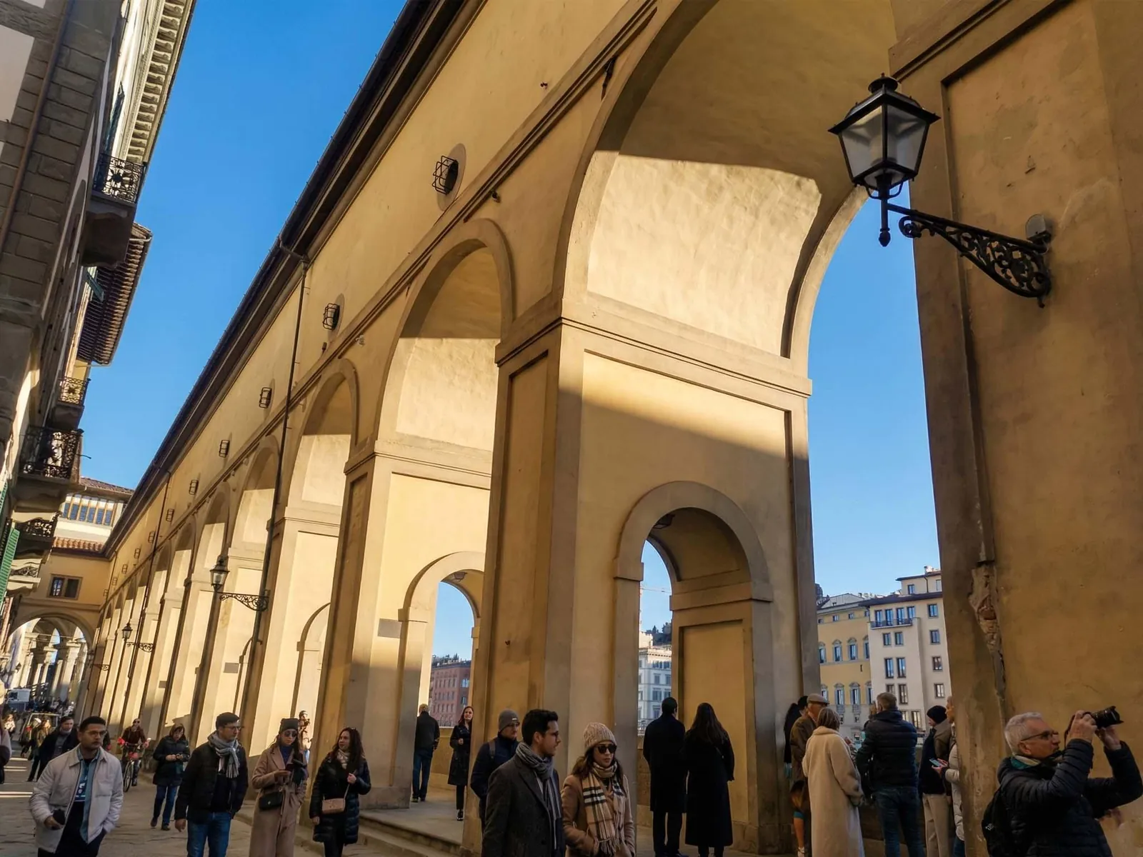 The arcade that carries the Vasari Corridor along the Arno