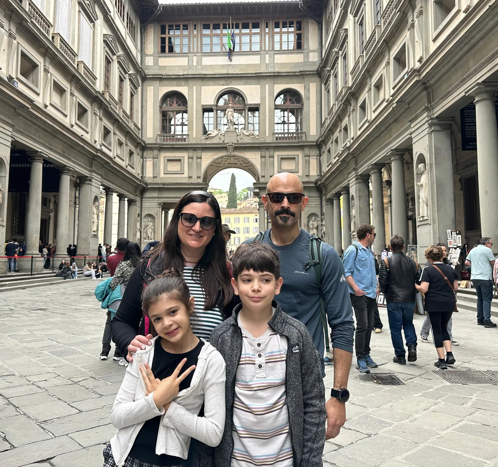 A family in the Uffizi courtyard before their private tour