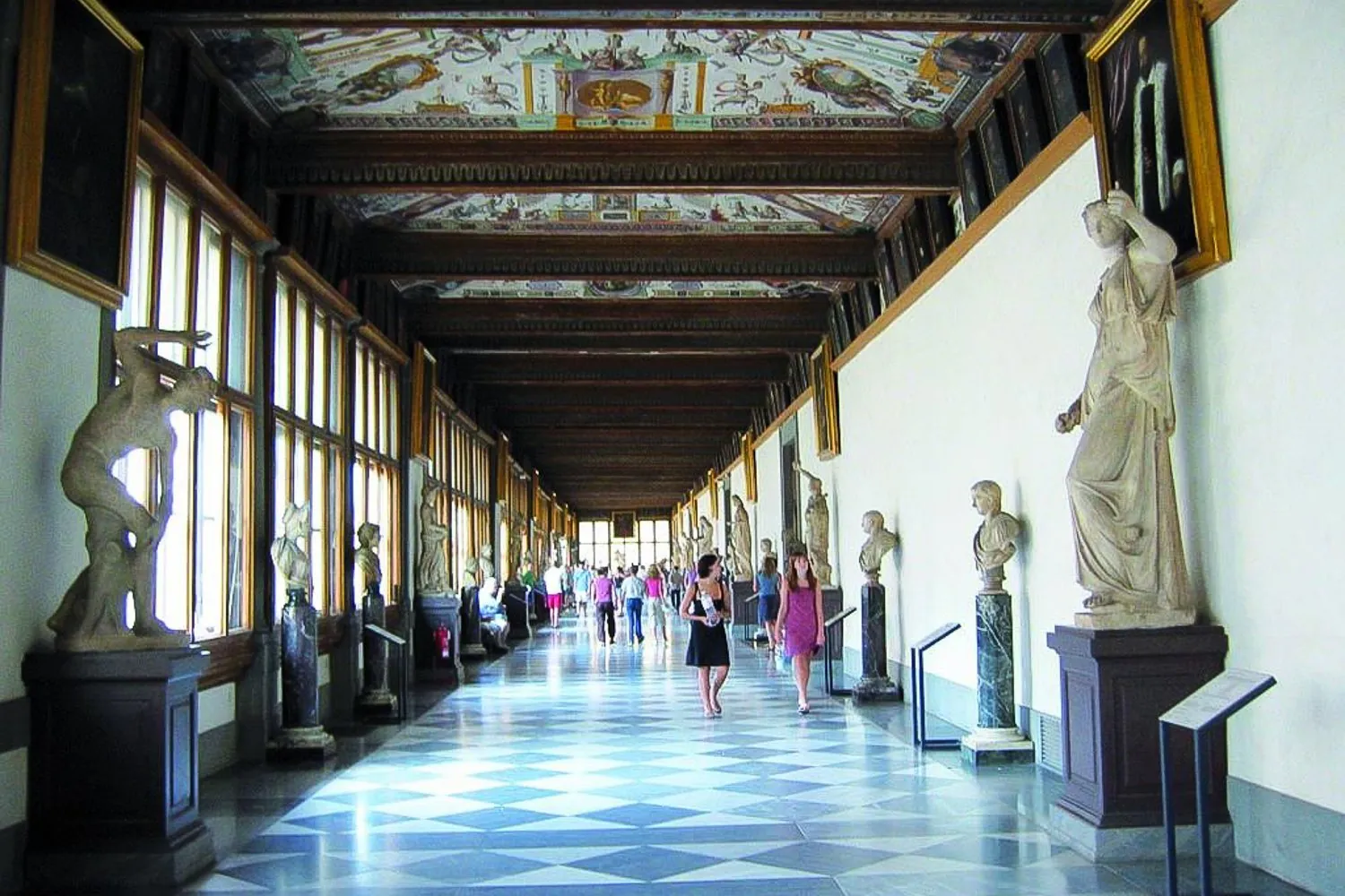 The Uffizi's first corridor with classical statues along the windows