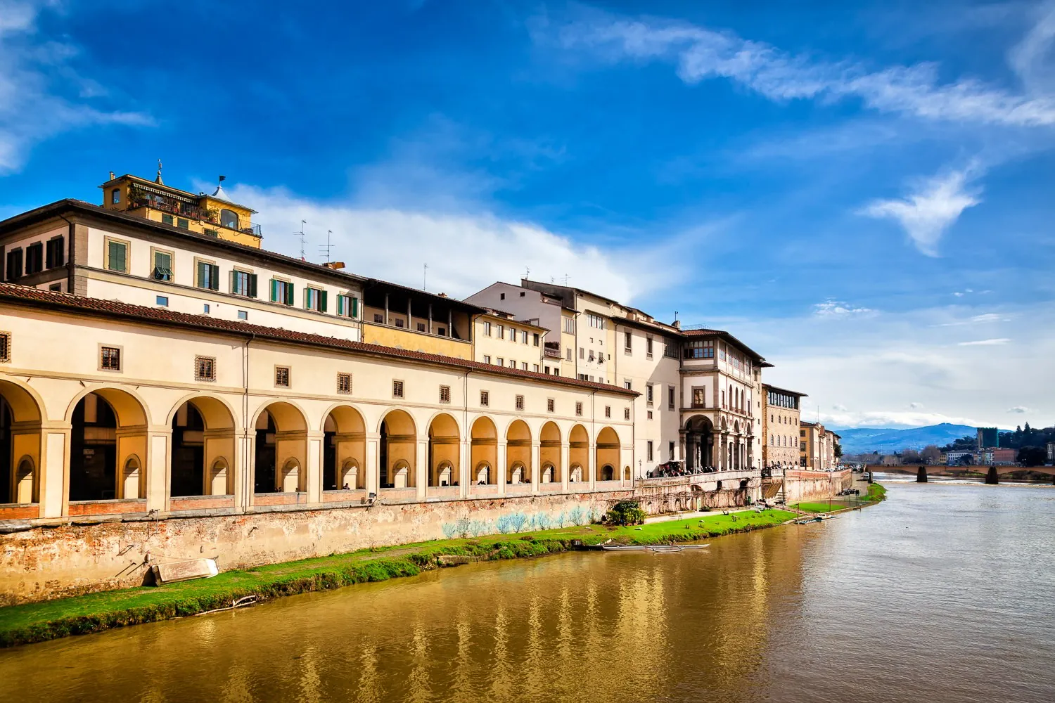 The Uffizi's riverside wing and the Vasari Corridor arcade along the Arno