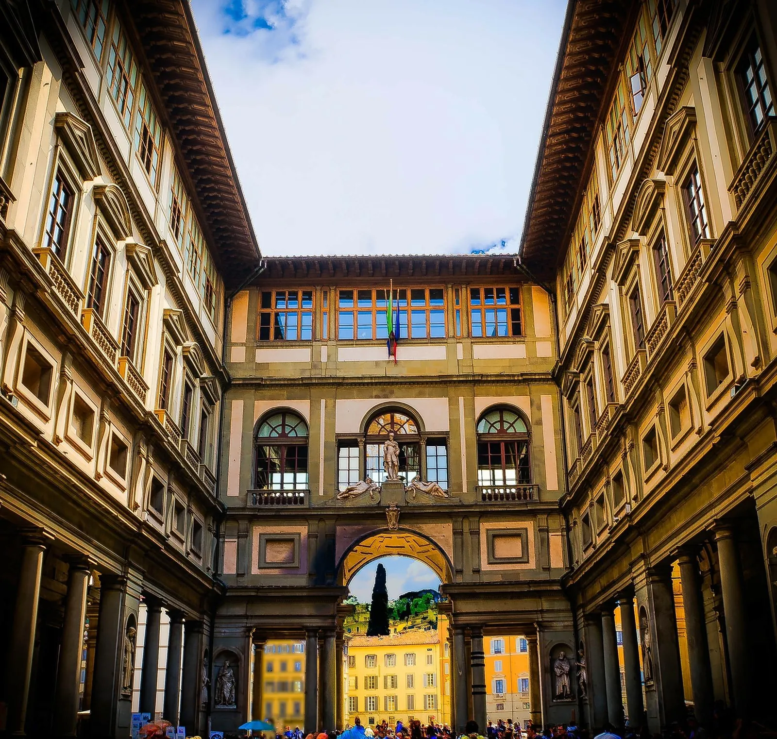 The Uffizi courtyard framing the houses across the Arno