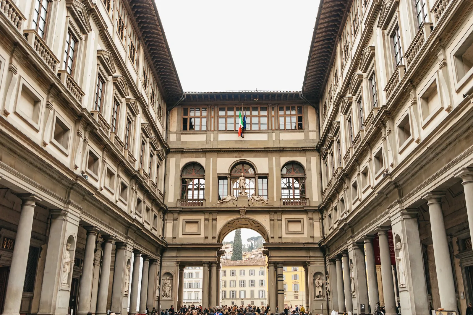The Uffizi Gallery courtyard seen from Piazzale degli Uffizi toward the Arno arch