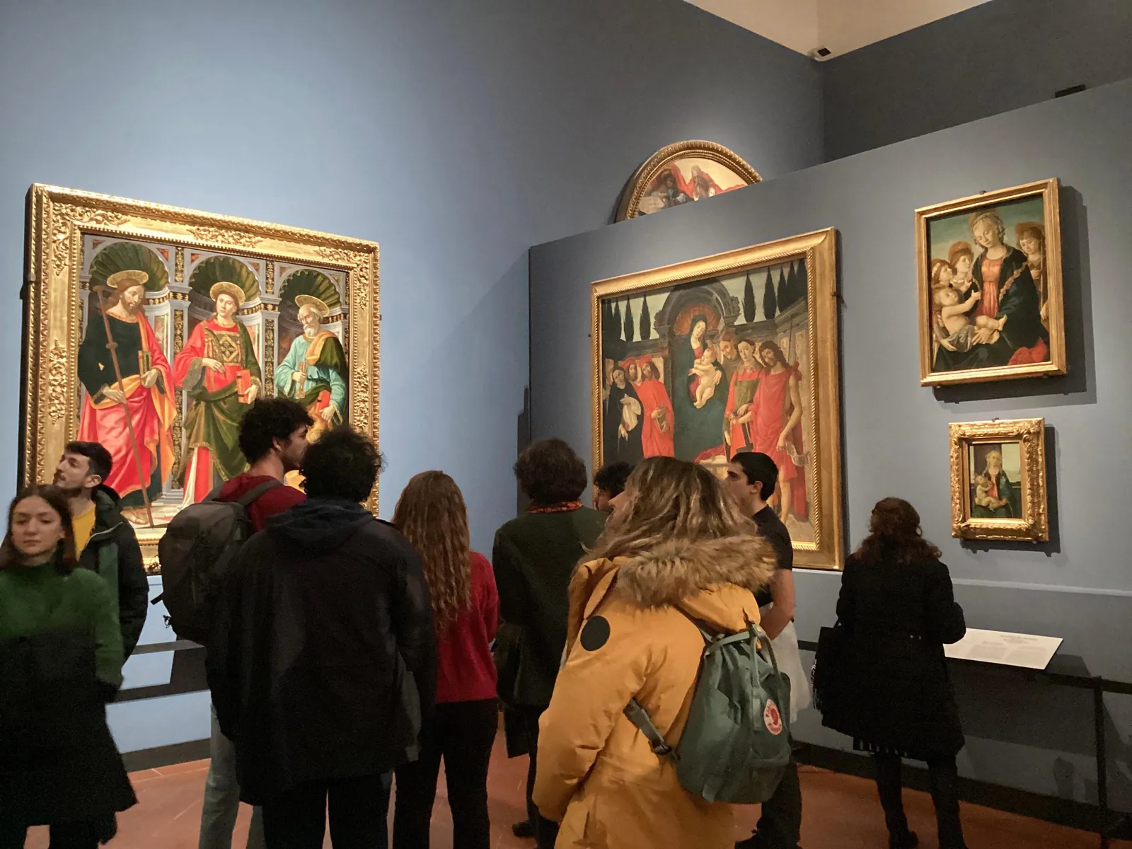 Group looking at early Renaissance altarpieces in the Uffizi