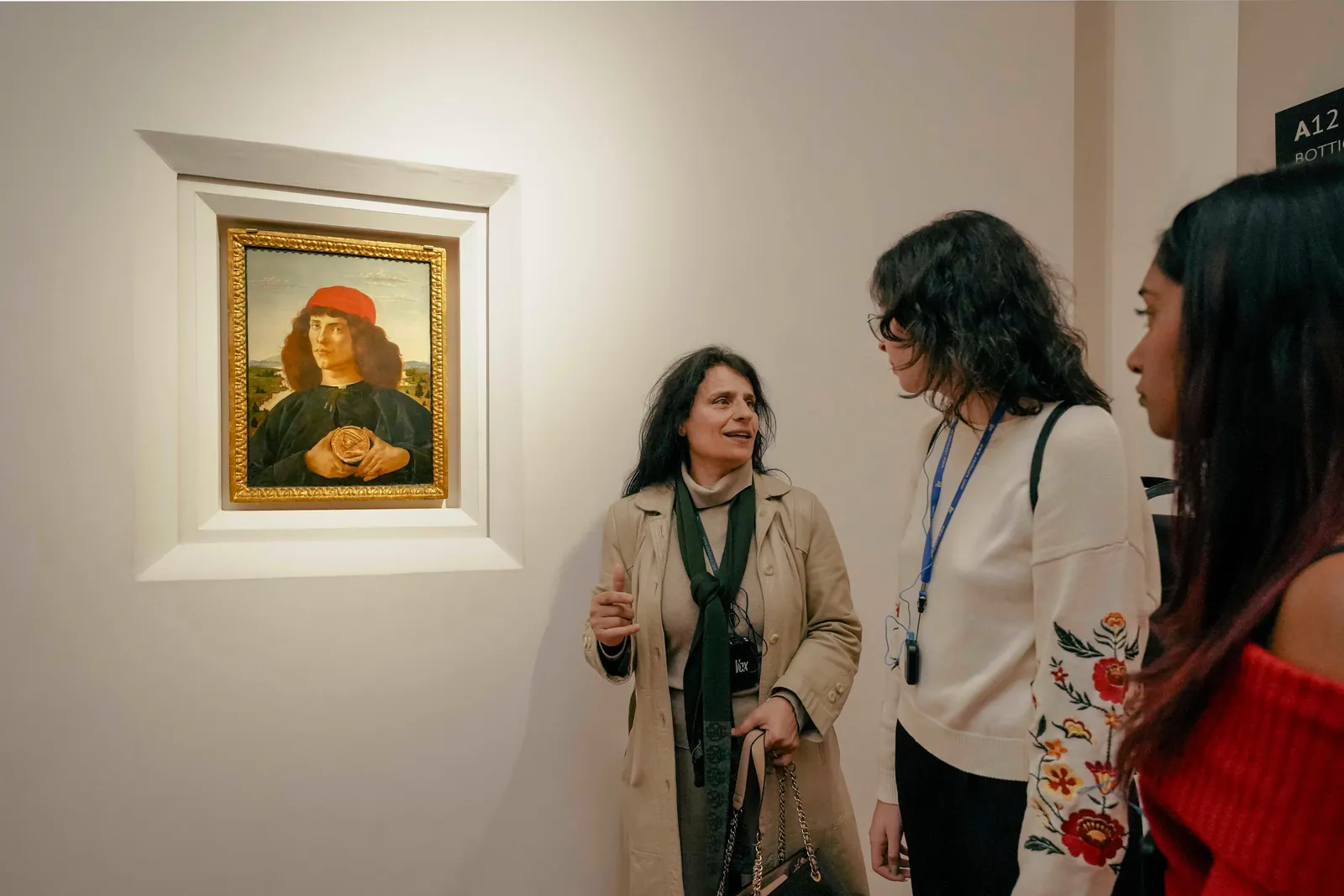 Licensed guide talking a small group through Botticelli's Portrait of a Man with a Medal