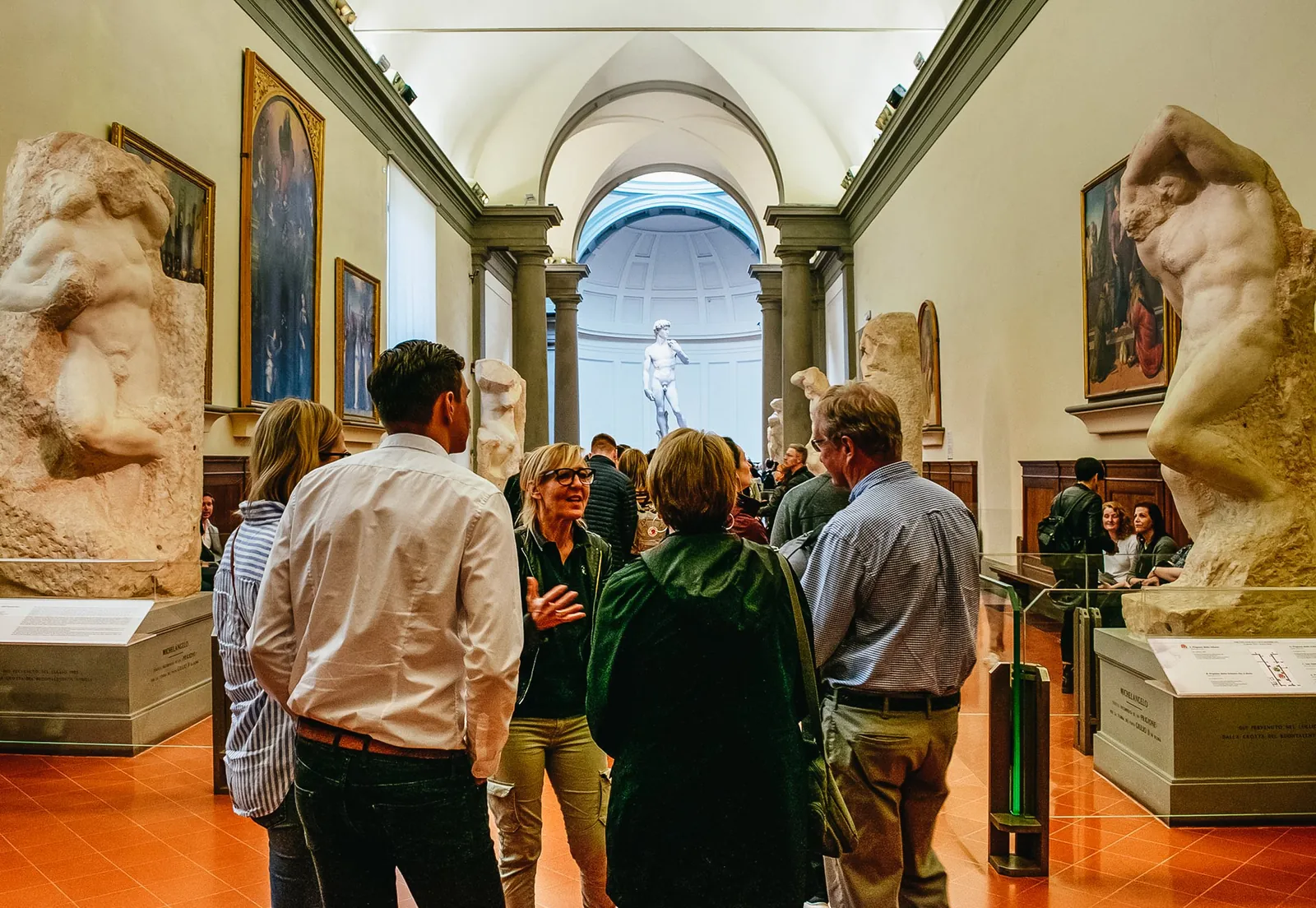 Visitors in the Hall of the Prisoners with David at the far end