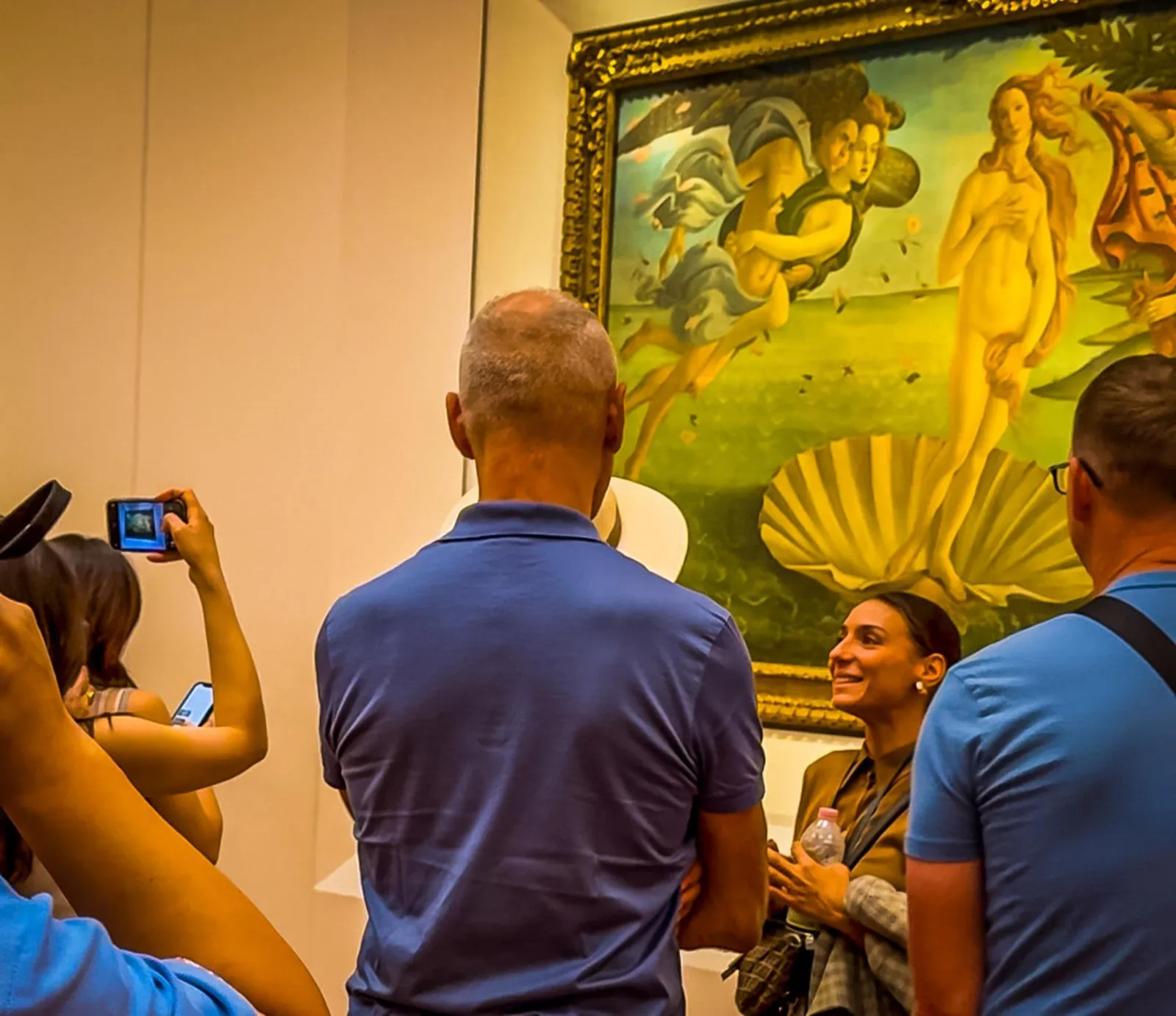 Small group photographing Botticelli's Birth of Venus