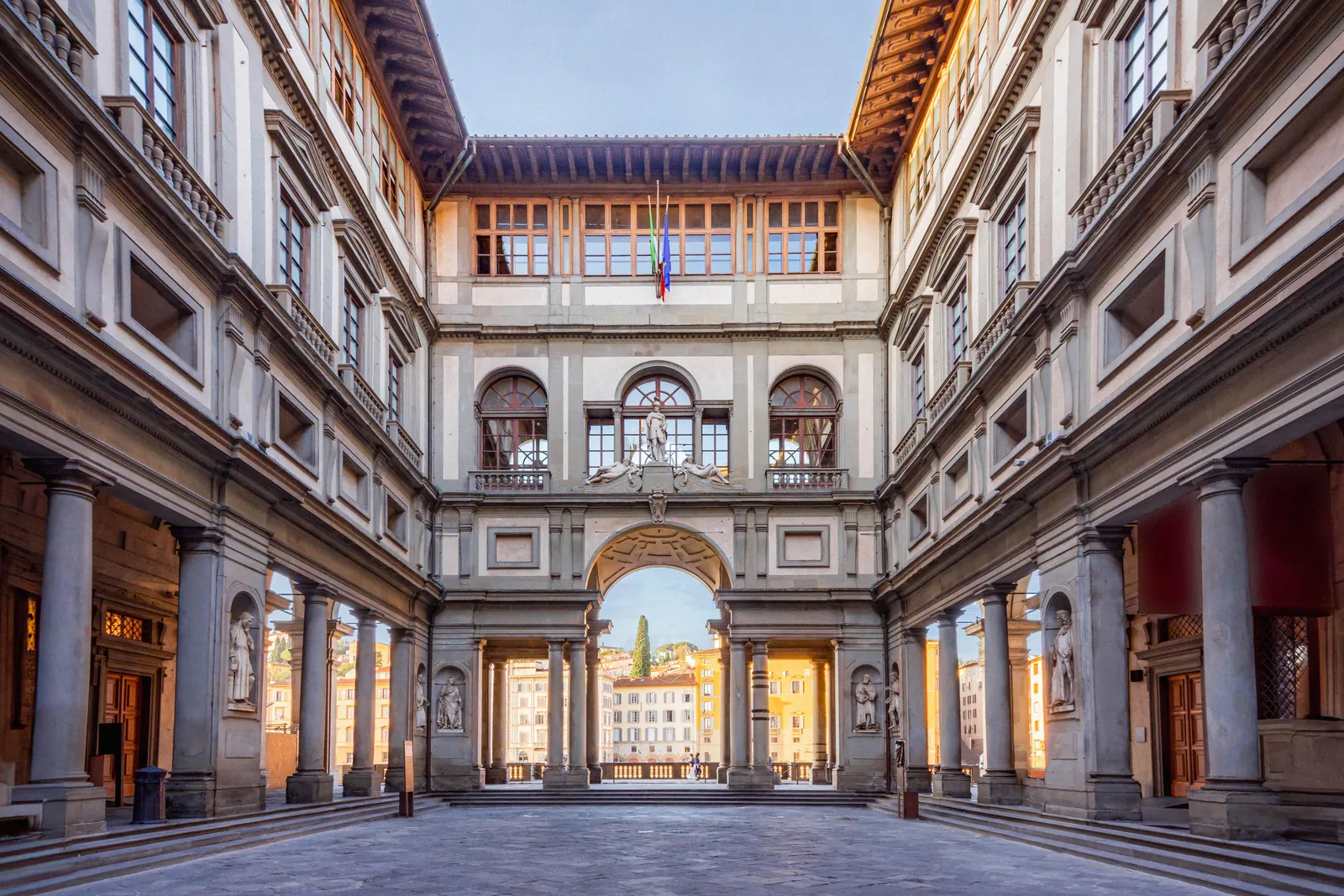 The Uffizi courtyard looking toward the Arno arch