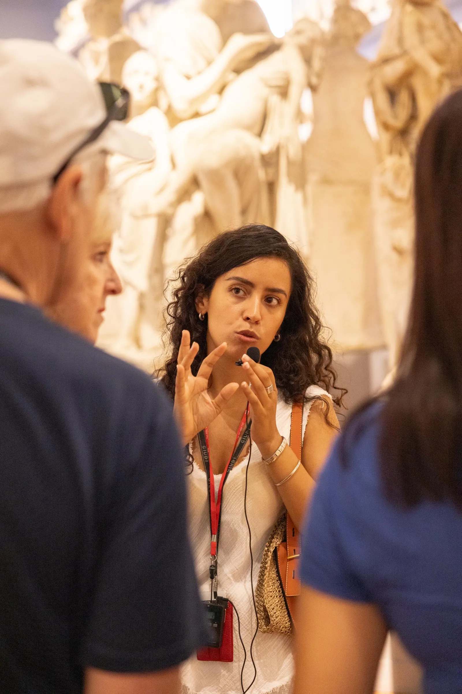 Guide explaining Michelangelo's sculptures to her group