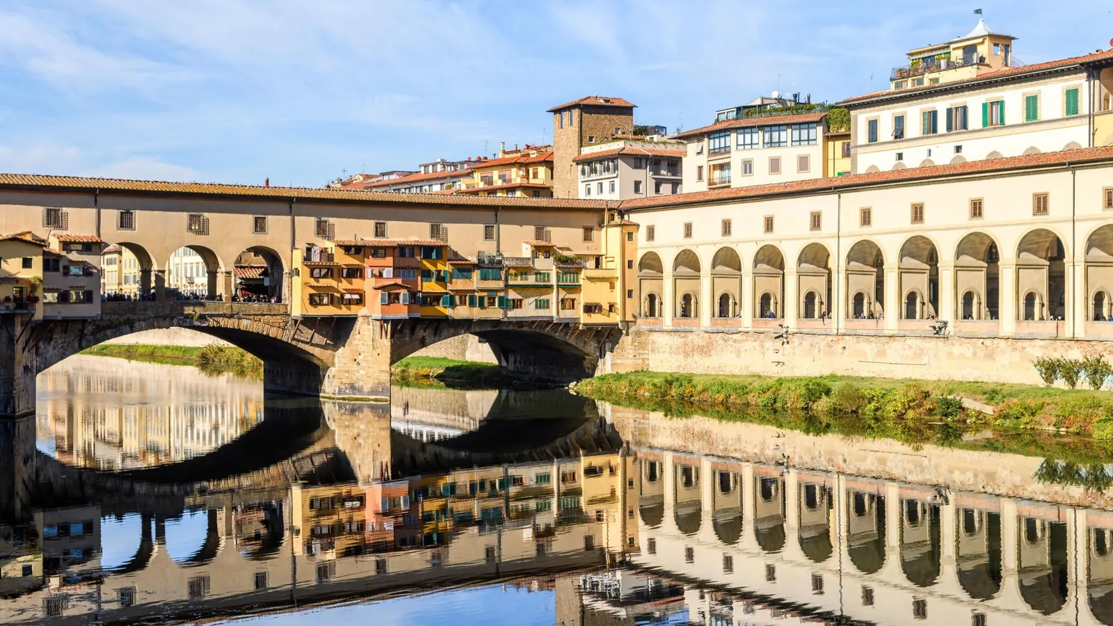 Ponte Vecchio and the Vasari Corridor arcade reflected in the Arno